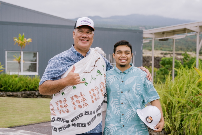 Two men smiling and posing together