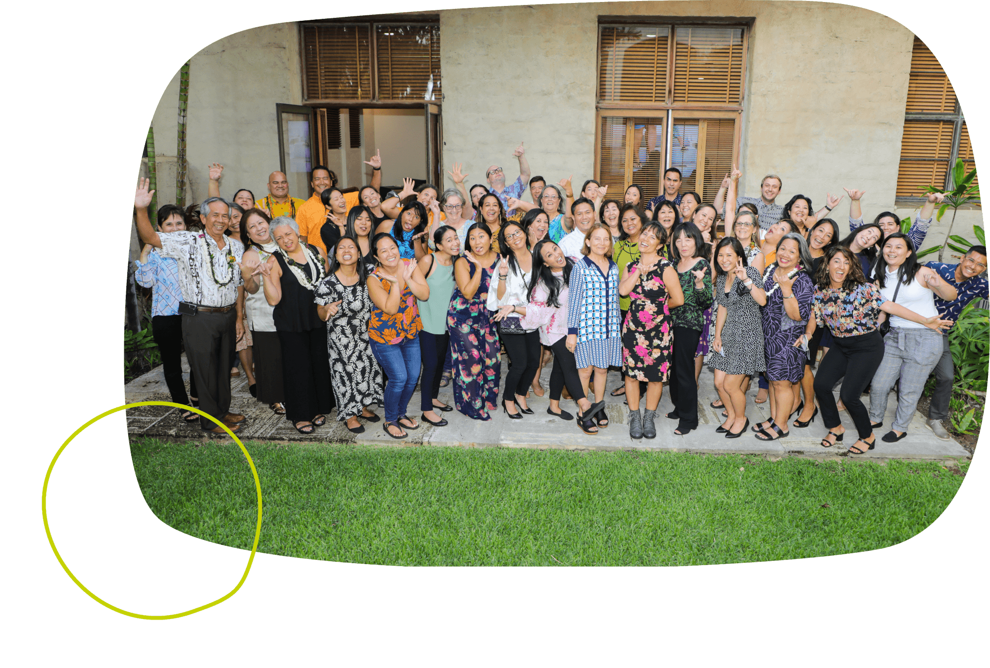 The Hawaii Community Foundation team all standing together while smiling and waving happily at the camera.